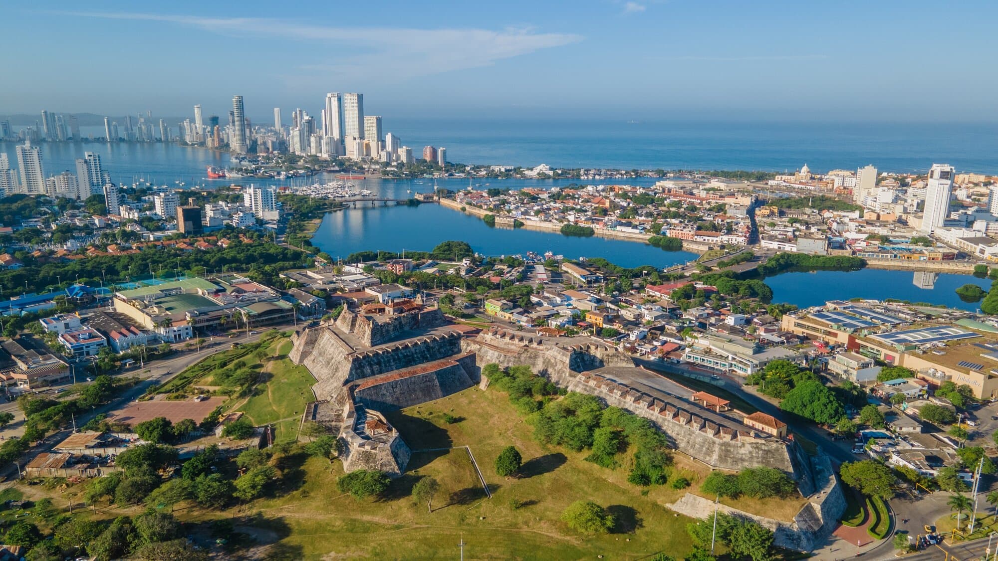 An aerial view of the San Felipe Castle with other buildings and the ocean surrounding it in Colombia, South America